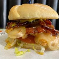 The Cluck Norris · Grilled chicken breast, honey pepper bacon, white cheddar, honey mustard, lettuce, and tomat...