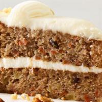 Carrot Cake Slice · Two-layer cake with shredded carrots, pineapple, sweetened coconut and pecan pieces, covered...