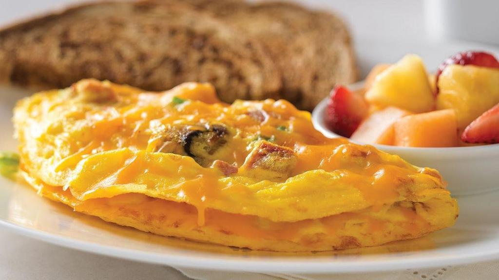 Bakers Omelette* · Ham, mushrooms, green peppers, tomatoes, onions and cheddar cheese.