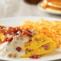 Smothered Meat Lover'S Omelette* · Country sausage, ham and onions. Topped with cheddar cheese, country sausage gravy and chopp...