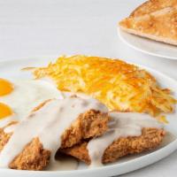 Chicken-Fried Steak & Eggs* · Chicken-fried steak with country sausage gravy and two eggs served with seasoned hash browns...