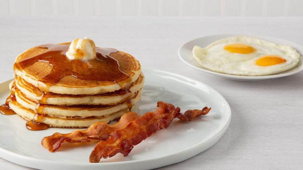 Buttermilk Pancake Combo* · Four-stack of our made-from-scratch buttermilk pancakes with two eggs, any style.