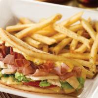 Honey Mustard Club Pita · Slow-roasted, hand-carved turkey, ham, bacon, tomato, lettuce and melted Swiss cheese with h...