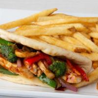 Chicken Stir-Fry Pita · Grilled chicken breast and teriyaki stir-fried vegetables with melted Swiss cheese on grille...