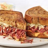 Marbled Rye Reuben · Hand-shredded corned beef, tangy sauerkraut, melted Swiss cheese and Thousand Island dressin...