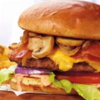 The Works Burger* · Fresh, never frozen, ground beef patty with American cheese, crispy bacon strips, garlic-gri...