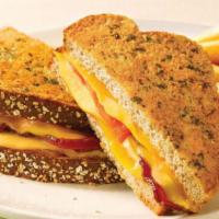 Supreme Grown-Up Grilled Cheese · Cherrywood-smoked bacon, tomato, cheddar, mozzarella and American cheese melted between Parm...