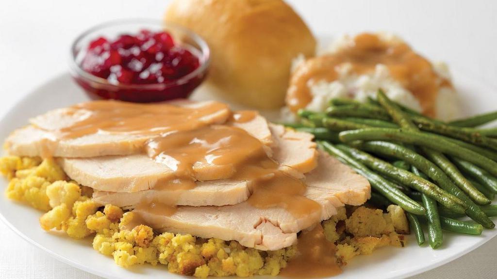 Slow-Roasted Turkey · Hand-carved turkey with stuffing, gravy, cranberry . sauce. Choice of two sides.
