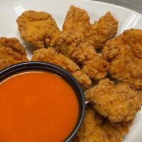 Boneless Chicken Wings · BP Boneless wings are 8oz of juicy battered chicken pieces fried to perfection served tossed...