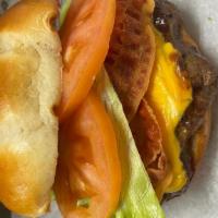 Bacon Cheeseburger · BP Bacon Cheeseburger is a 1/2-pound juicy beef patty perfectly grilled, topped with bacon a...