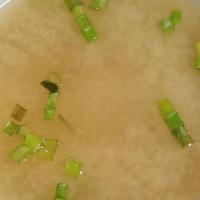 Small Miso Soup  · Soybean soup with scallions, seaweed and tofu.