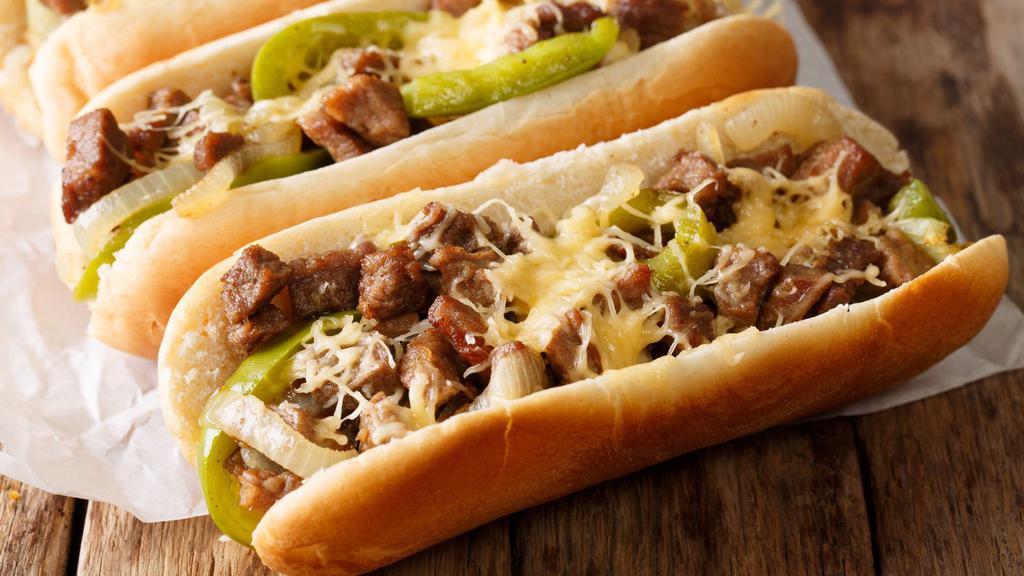 Philly Cheesesteak With Bacon · Classic Philly cheesesteak with green pepper, artfully sautéed onions and flavorful crispy bacon.