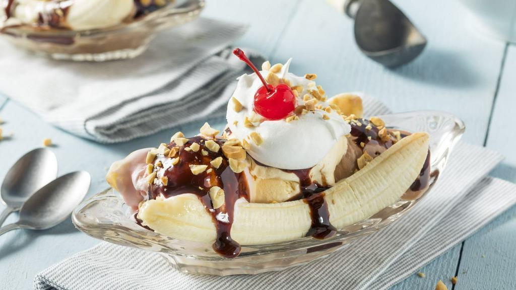 Banana Split · Classic banana split topped with chocolate syrup and crunchy nuts.