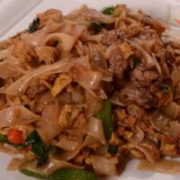 Pad Kee Mao With Beef (Drunken Noodle) · Stir-fried flat rice noodle in dark sweet soy sauce with bell pepper, Thai basil, oriental b...