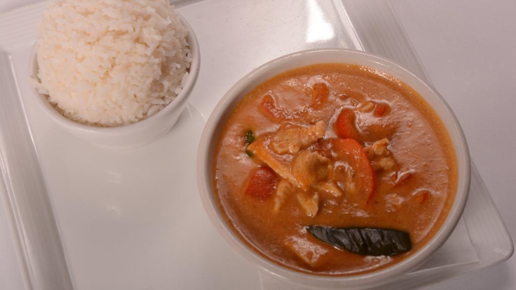 Panang Curry With Chicken · Panang curry paste with a touch of peanut sauce, bell pepper, and a pinch of kaffir leaf.