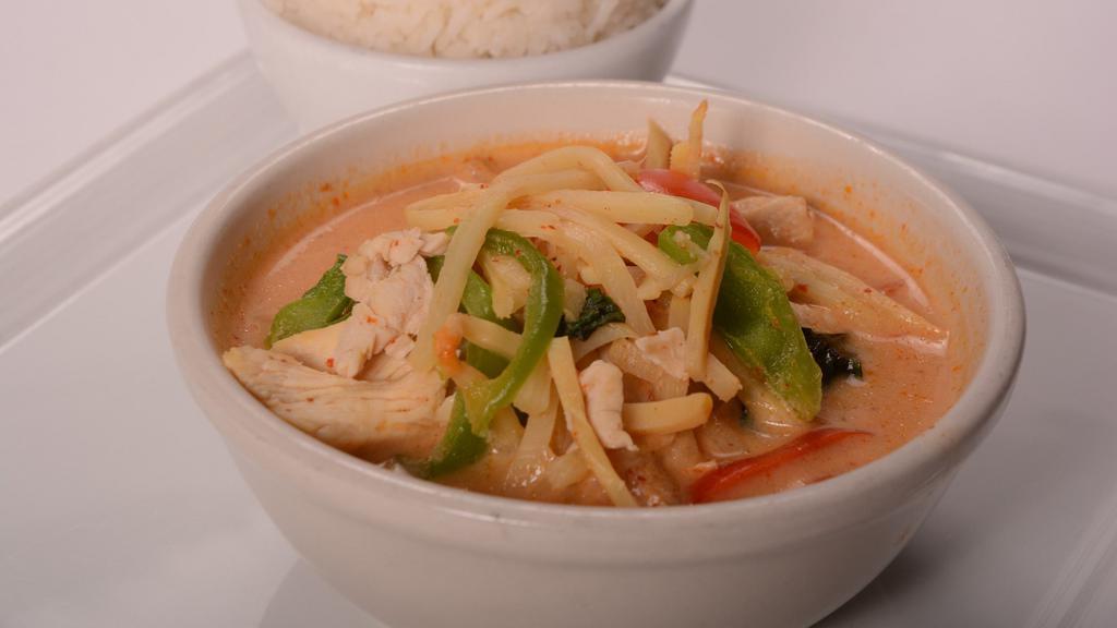 Red Curry With Chicken · Red curry paste simmered with fresh basil, bamboo slice, and bell pepper.