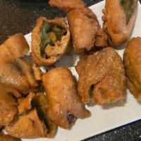 Cut Mirchi - 6 Pieces · Spicy, vegetarian, vegan. Jalapeños battered with chickpea flour mixed with herbs, spices, a...