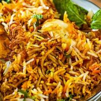Egg Biryani · Basmati Rice cooked in Dum style with Egg & Spices.