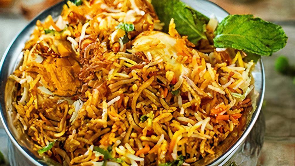 Egg Biryani · Basmati Rice cooked in Dum style with Egg & Spices.