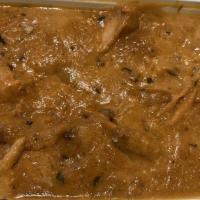 Butter Chicken · Tender chicken grilled peeled and cooked in creamy rich butter and tomato-based sauce.