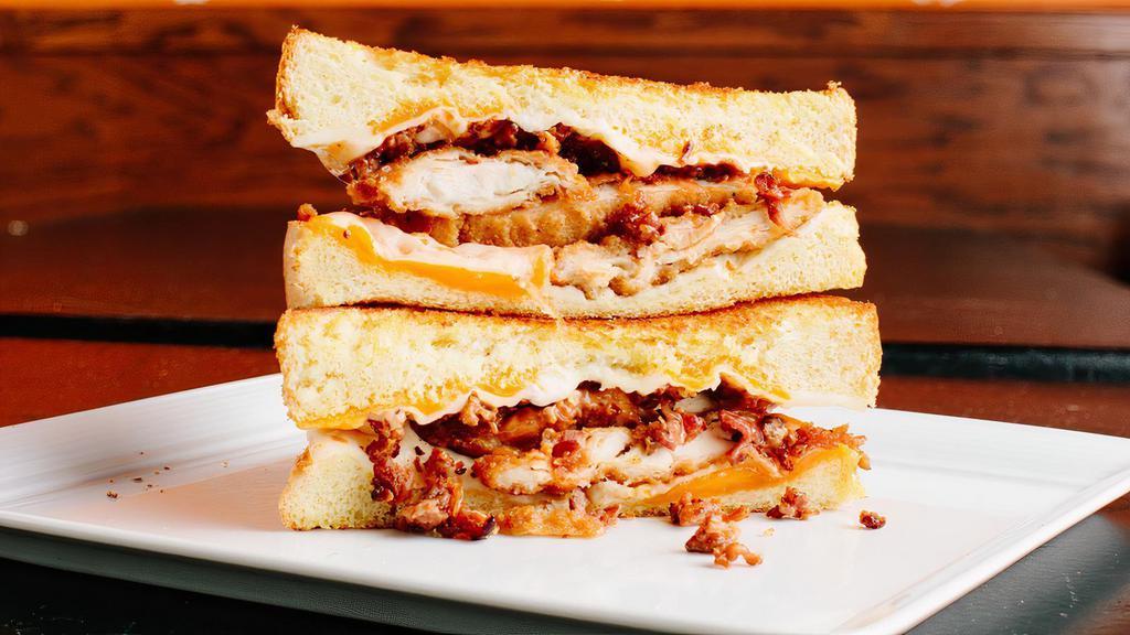 The Tenderizer · Cheddar cheese, mozzarella cheese, bacon, fried chicken tenders, and our special Tendy sauce on Texas toast. Served with a side of ranch dressing. Contains gluten, peanuts, dairy, soy, and nightshades. We cannot make substitutions.