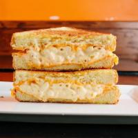 The Mac  · American cheese, cheddar cheese spread, and homemade macaroni and cheese on Texas toast. Ser...