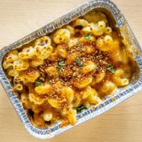 Just Mac · Cavatappi noodles tossed in a creamy cheese bechamel (white sauce), 6-cheese blend, and garl...