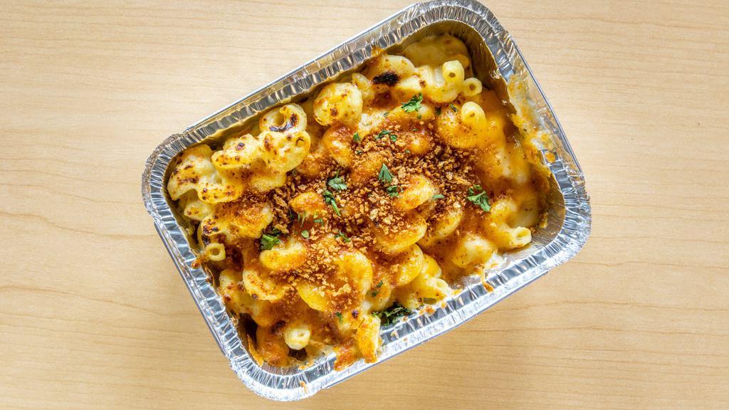 Just Mac · Cavatappi noodles tossed in a creamy cheese bechamel (white sauce), 6-cheese blend, and garlic panko topping