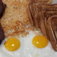 Sampler · Two jumbo French toast, eggs and two slabs of bacon, and hashbrowns. Served with fruit