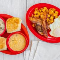 Breakfast At Large · Bacon, Ham and Sausage, 2 eggs, hash browns, 2 biscuits, and your choice of  gravy.