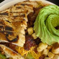 Grilled Chicken Cobb Salad · Tender grilled chicken breast on a bed of lettuce, tomato, onion, cheese, avocado, and crout...