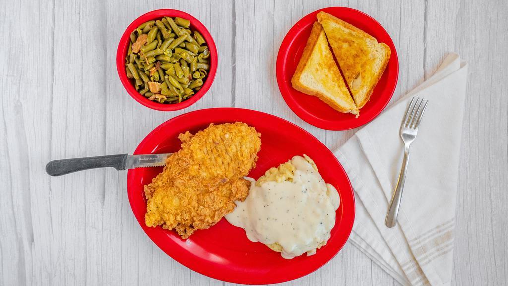 Chicken Fried Chicken · Boneless Skinless tenderized chicken breast hand-breaded, fried, and covered in gravy. Served with the vegetable of the day, your choice of fries, mashed potatoes, or chips, and a slice of Texas toast.