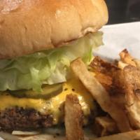 Cheeseburger · 1/2 pound burger, served with fresh cut fries or homemade chips, lettuce, tomato, pickles an...