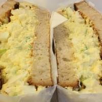 Egg Sandwich · Two scrambled eggs, American cheese, choice of ham, bacon or sausage on a croissant, English...