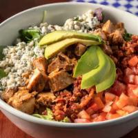 Cobb Salad · Chopped roasted chicken, bacon, avocado, roma tomato, and blue cheese. Served on mixed green...