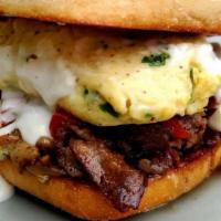 Philly Cheesesteak Breakfast Sandwich · Scrambled eggs + ribeye steak + green peppers + onions + cheese whiz - on a hoagie.