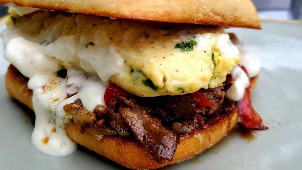 Philly Cheesesteak Breakfast Sandwich · *Scrambled Eggs + Ribeye Steak + Green Peppers + Onions + Cheese Whiz - on a  Hoagie.