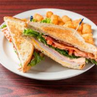 Clubhouse · Wheatberry bread, cheddar cheese, turkey, ham, bacon, lettuce, tomato, hot ham mac and chees...