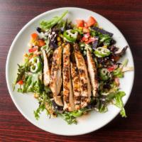 Southwest Chicken Salad · Mixed greens, black beans, smoked corn, jalapeños, tomato, and tortilla strips. Topped with ...