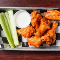 Traditional Or Boneless Wings · Served with celery and ranch or blue cheese dressing.
