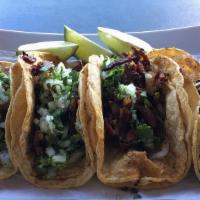 Al Pastor Taco · Marinated pork. Comes with onion and cilantro.