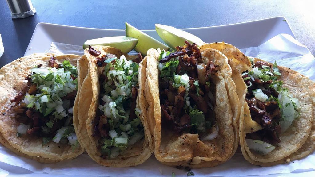 Al Pastor Taco · Marinated pork. Comes with onion and cilantro.