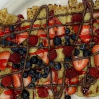 Fruit Crepes · Strawberries, raspberries and blueberries topped with glaze