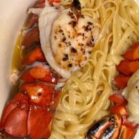 Lemon Butter Lobster · Lemon and Garlic Spaghetti noodles topped with butter basted lobster tail