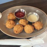Hash Holes · Five hashbrown croquettes made with Cheddar, smoked Gouda and bacon. Served with southwest r...