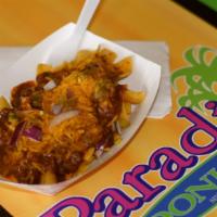 Frito Chili Pie · Fritos covered with chili, onions and jalapeños optional.
