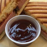 Bbq Panini · Smoked hot links and bologna with bbq sauce grilled on a panini press