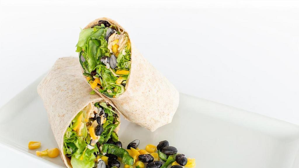 Southwest Wrap · Spring mix and baby arugula, roasted poblano peepers, avocado, black beans, corn, artisan cheese blend, with southwest vinaigrette, and corn tortilla chips. Gluten free. Vegetarian.  Spicy.