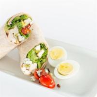Cobb Wrap · Roasted chicken, romaine, avocado, bacon, blue cheese, egg, grape, tomatoes, with ranch dres...