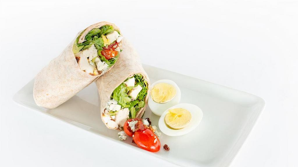Cobb Wrap · Roasted chicken, romaine, avocado, bacon, blue cheese, egg, grape, tomatoes, with ranch dressing. Gluten free.